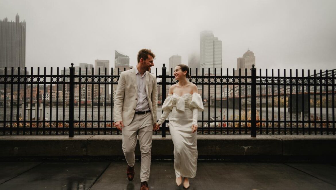 a man and a woman walking in the rain