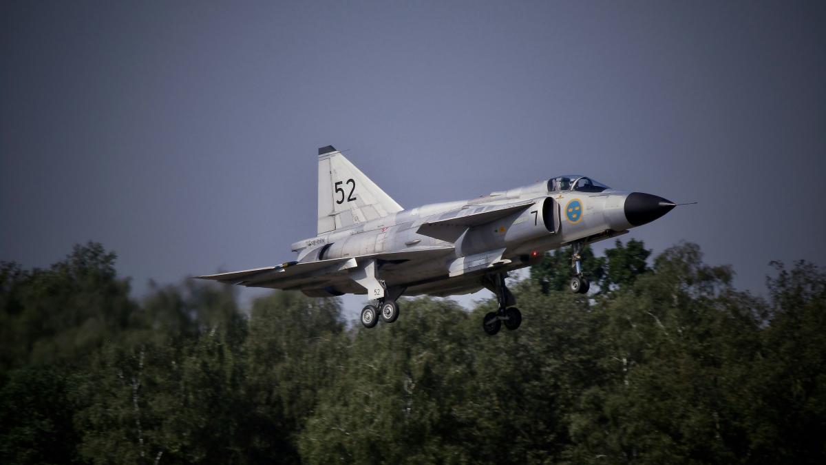 a fighter jet taking off from a runway