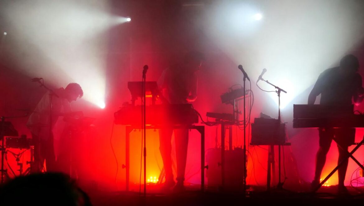 a group of people that are standing on a stage