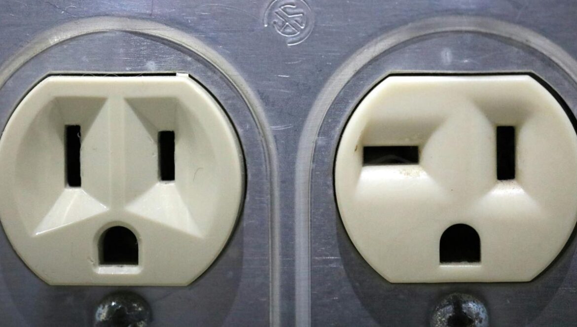 a couple of white electrical outlets sitting next to each other