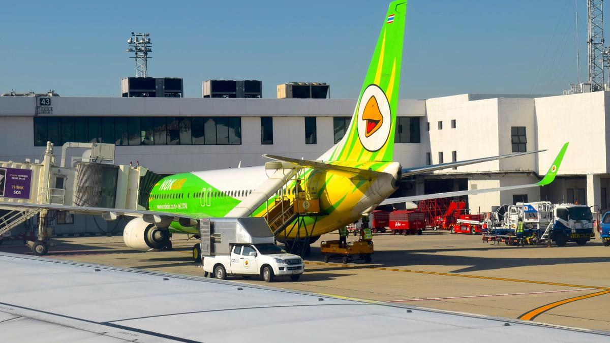 a large jetliner sitting on top of an airport tarmac