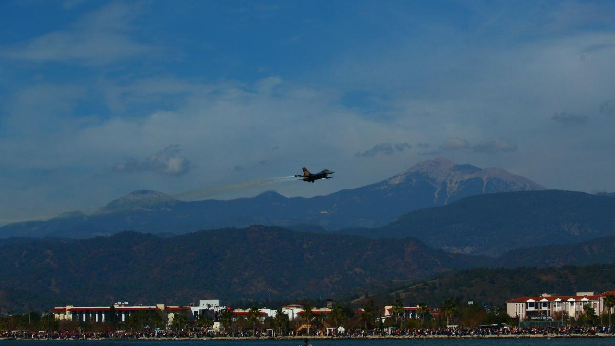 a plane flying over a body of water