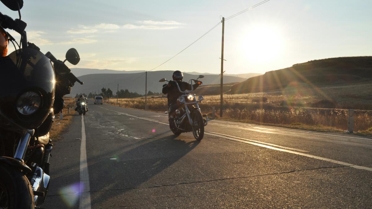 a couple of motorcycles that are sitting in the street