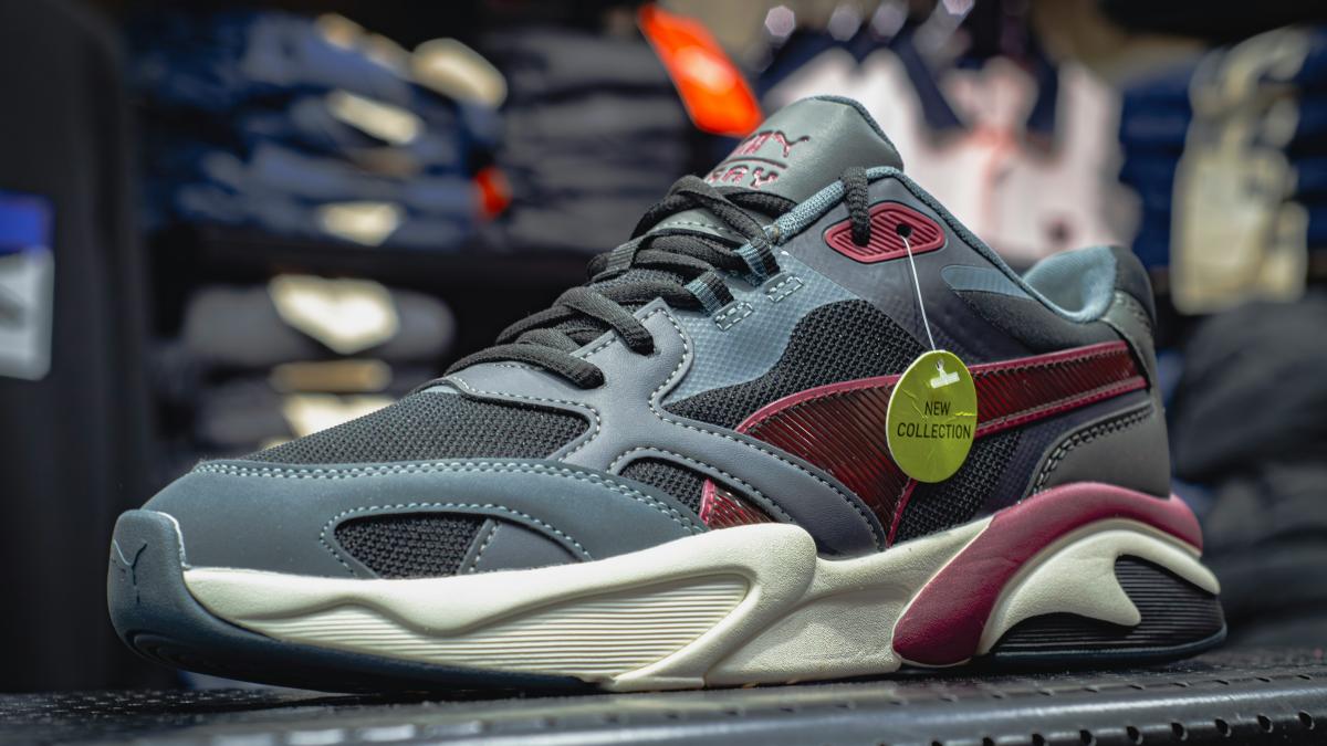 a close up of a shoe on a shelf