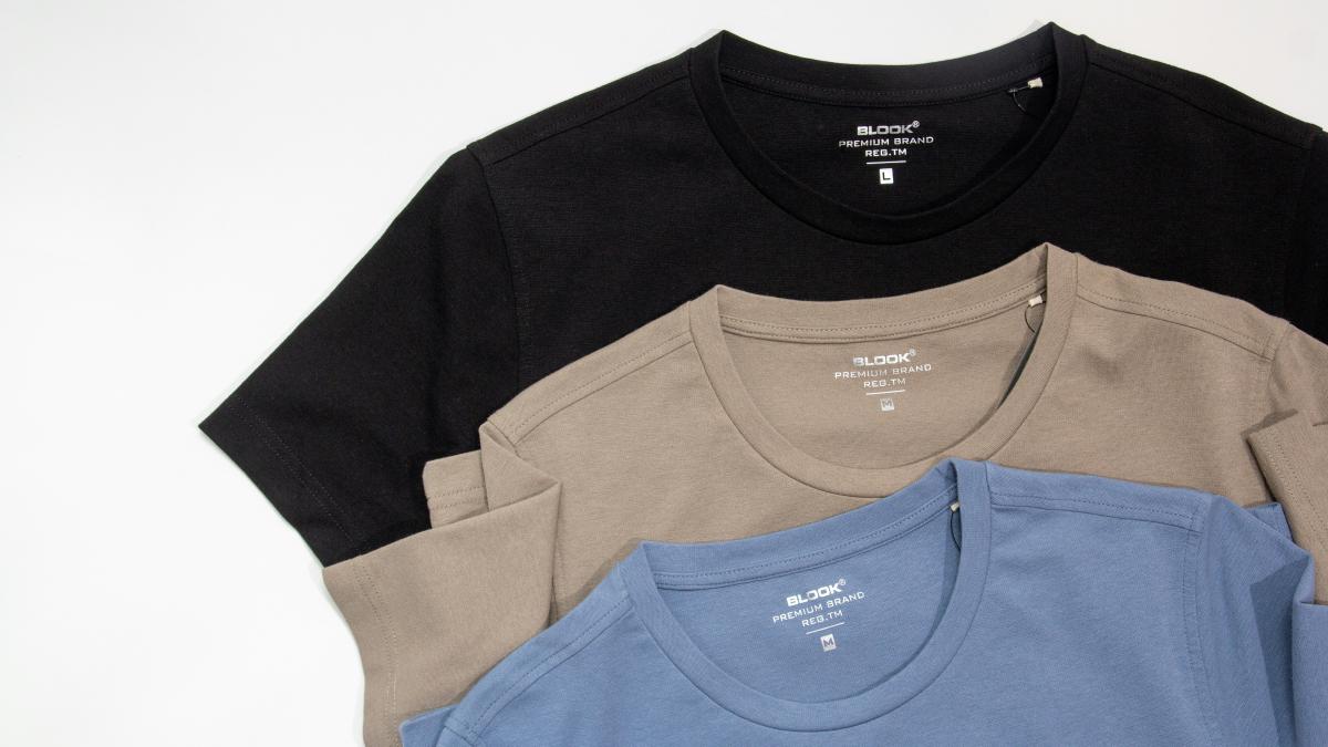 a group of three shirts sitting next to each other