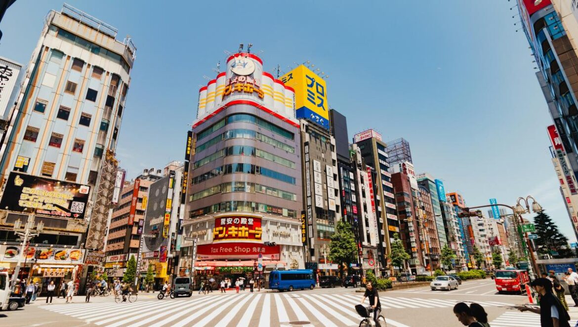 A city street filled with lots of tall buildings