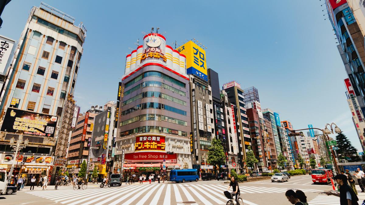 A city street filled with lots of tall buildings
