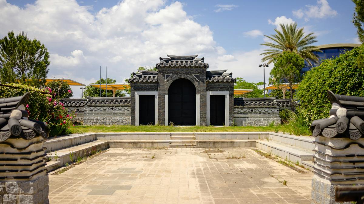 A building with a gate in the middle of it