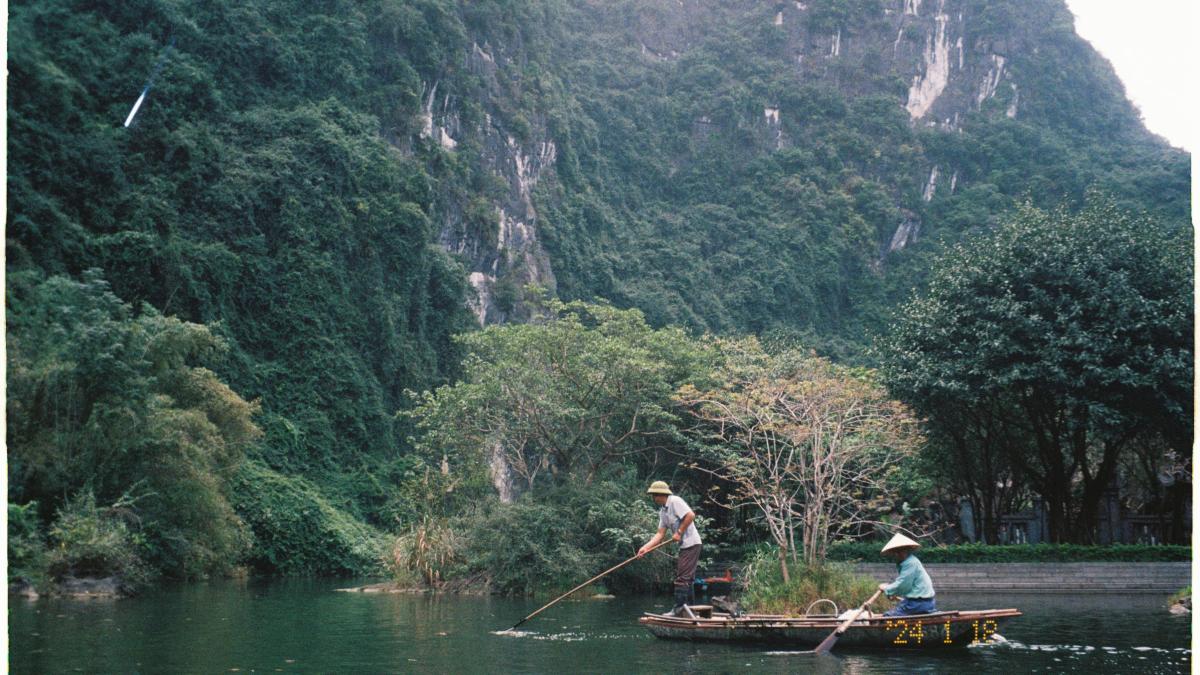 Two people in a boat on a river