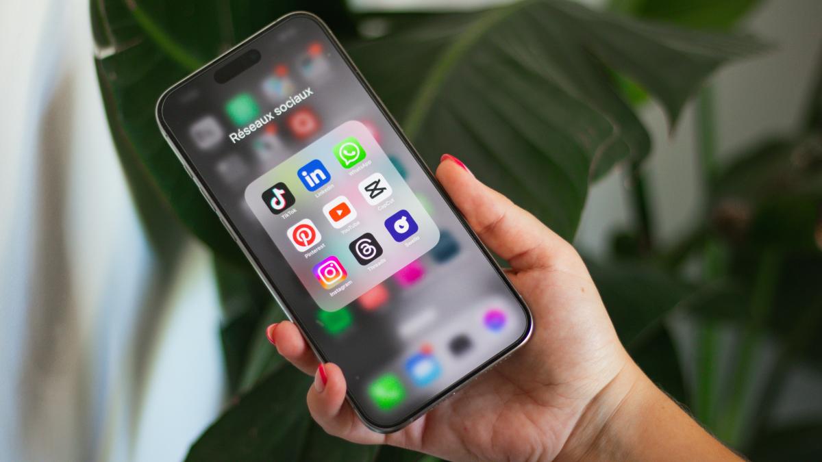 A person holding a cell phone in their hand