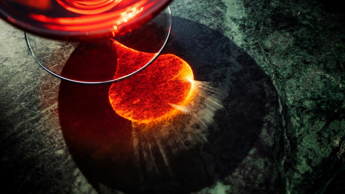 A close up of a wine glass on a table