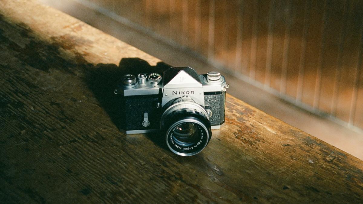A camera sitting on top of a wooden table