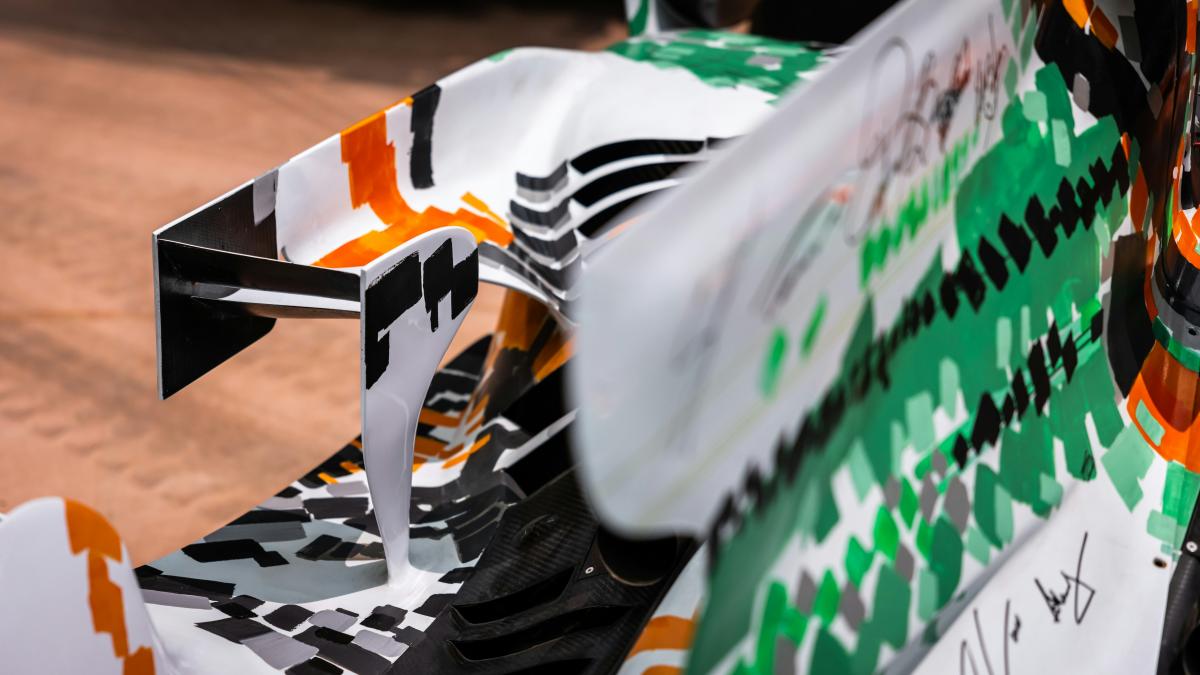 A close up of a racing car on a track