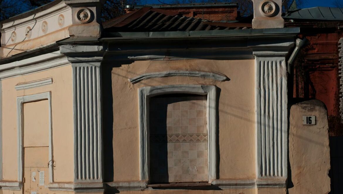A weathered building facade with unique architectural details.