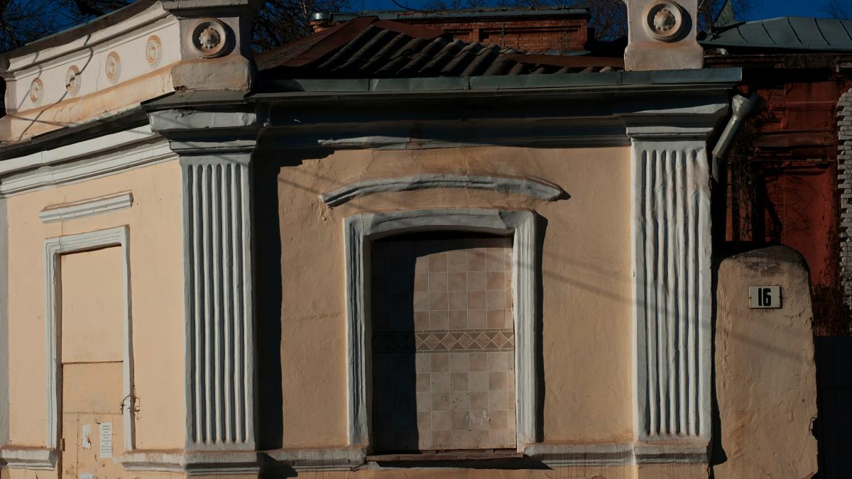 A weathered building facade with unique architectural details.