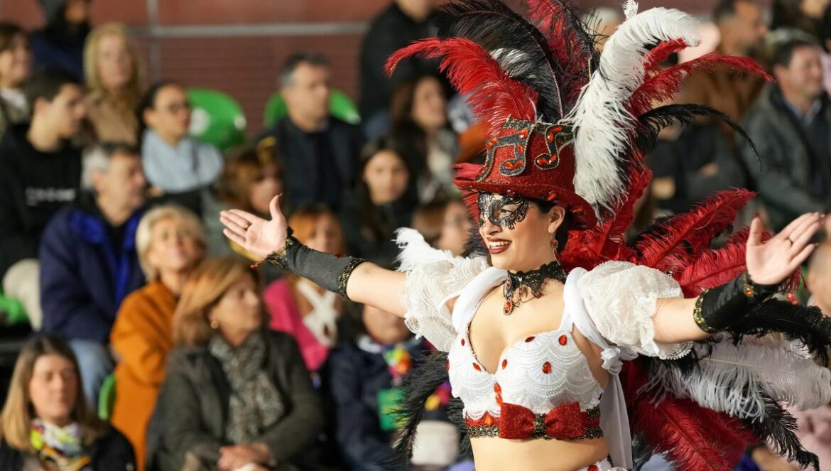 A woman performs in costume during a parade.