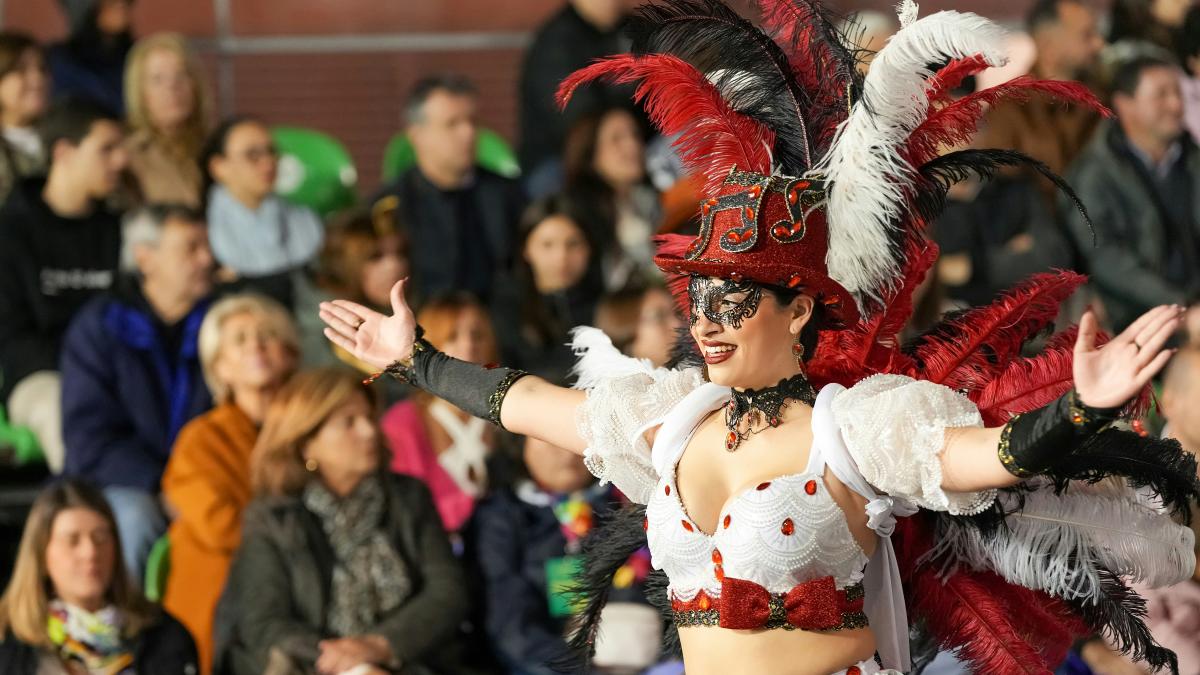 A woman performs in costume during a parade.