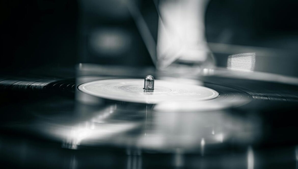 A record player with its needle engaged.