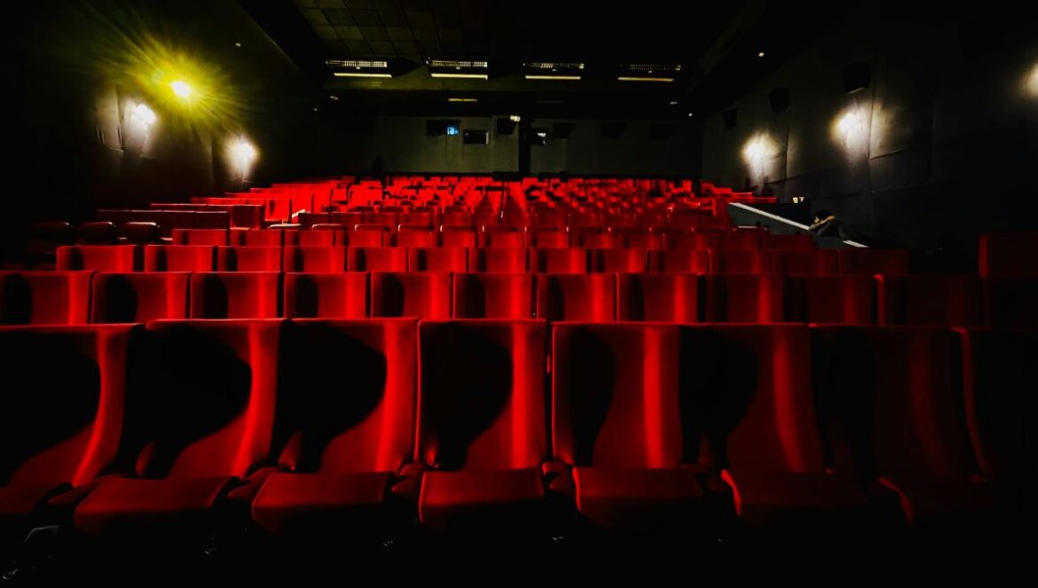 Empty movie theater seats await the audience.