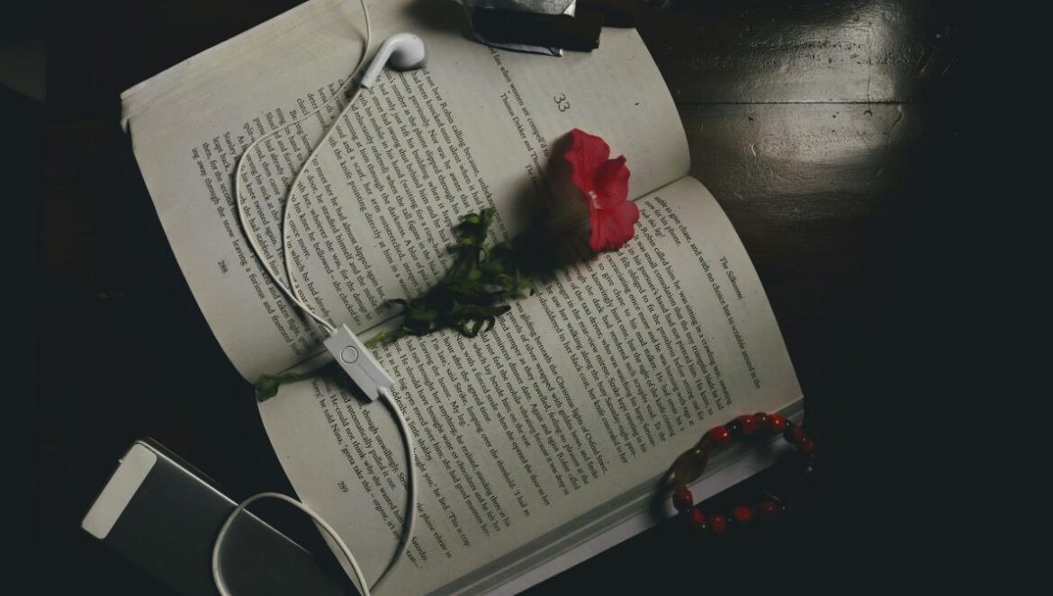 red rose on white ruled paper