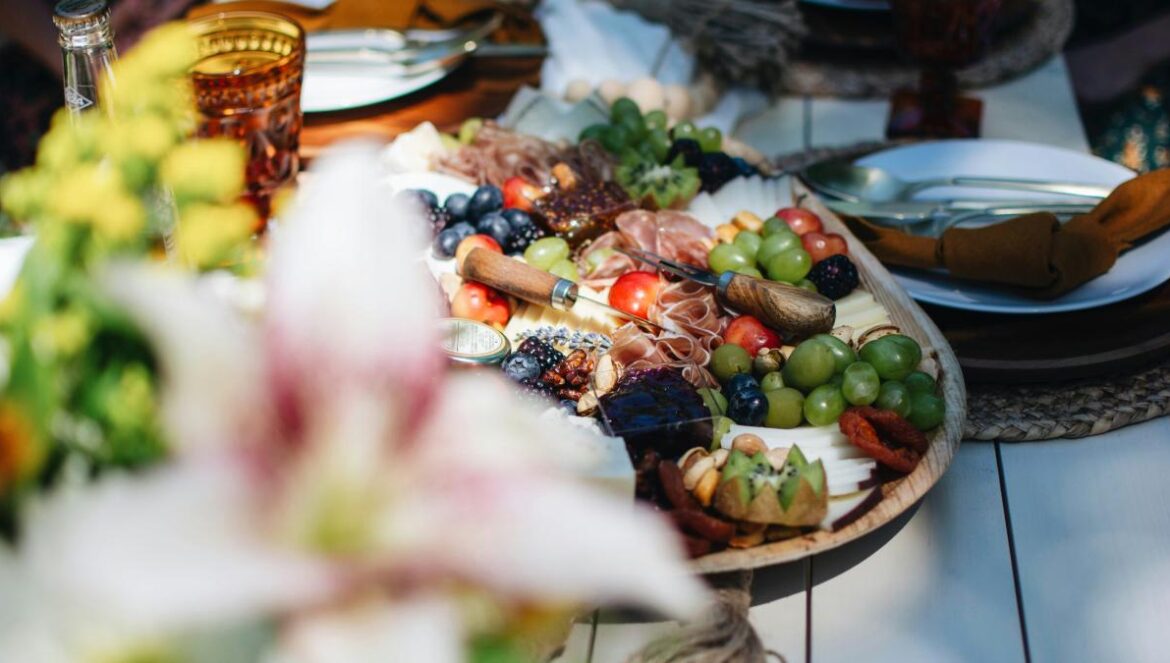 a platter of fruit and vegetables on a table