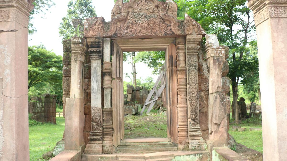 a doorway in the middle of a cemetery
