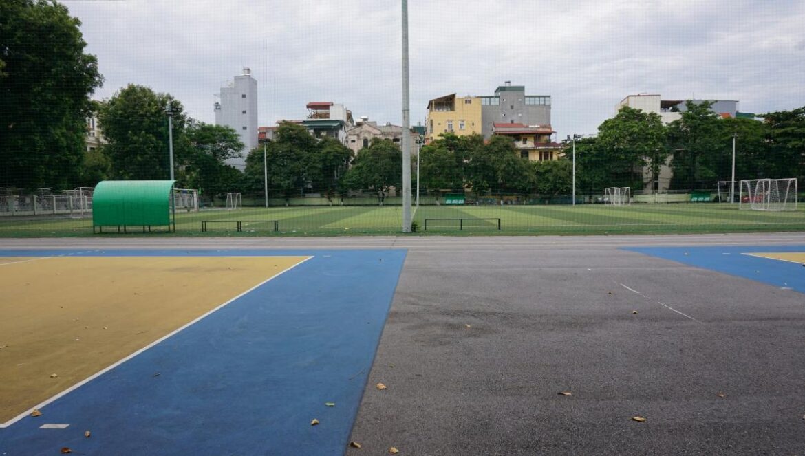 An empty basketball court in a city park