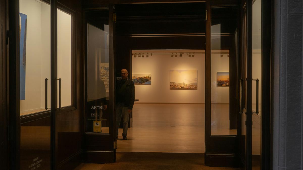 View into an art gallery with paintings on display.