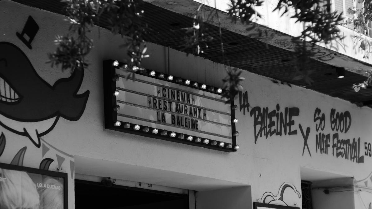 A building with a bunch of signs on the side of it