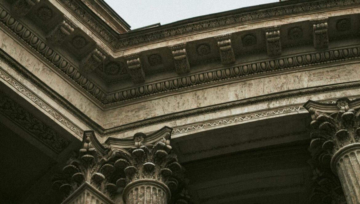 a clock is on the side of a building