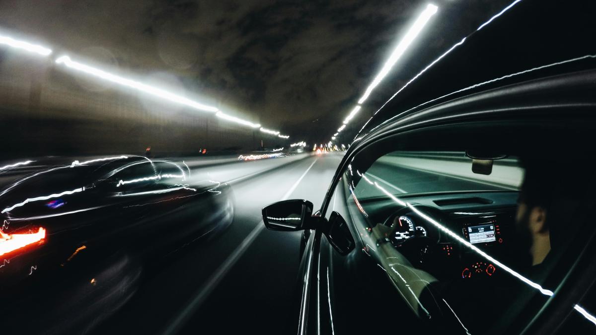 close-up photo of black car inside tunnel