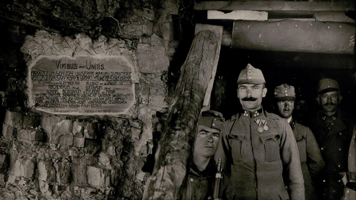 grayscale photography of people inside tunnel