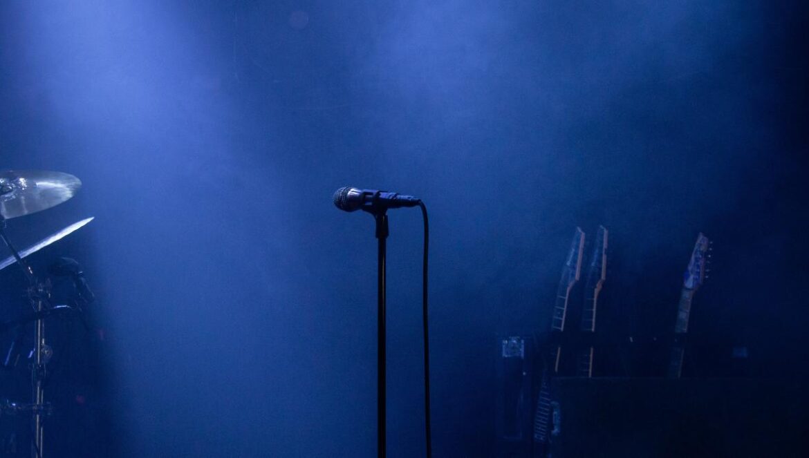 black microphone on stand near microphone stand