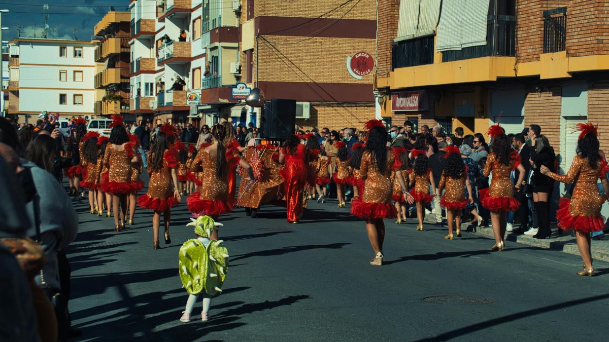 a large group of people walking down a street