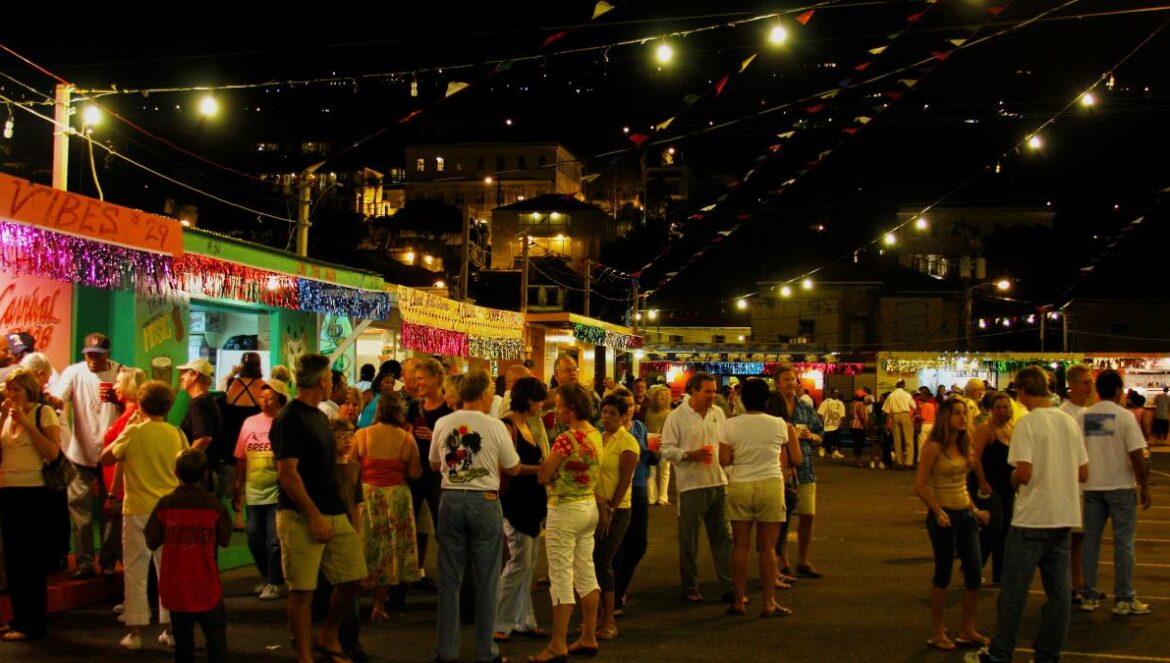 a crowd of people standing around a food truck