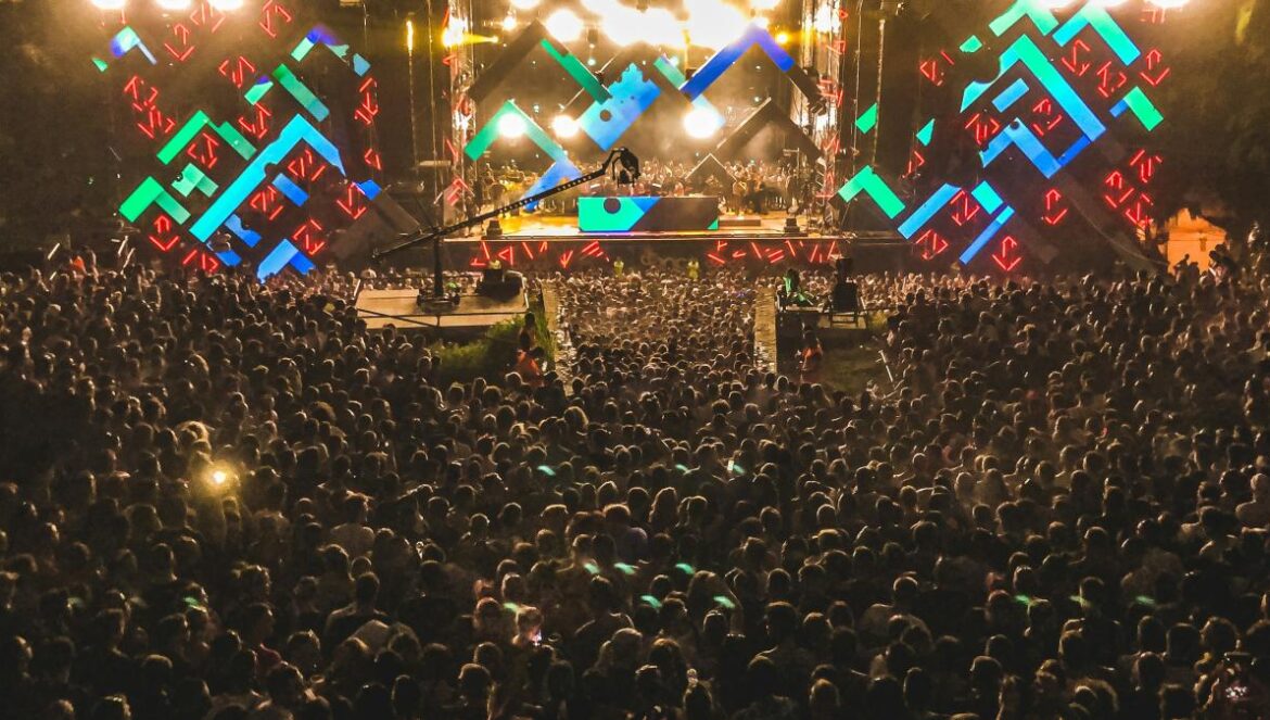 crowd of people watching concert during night time