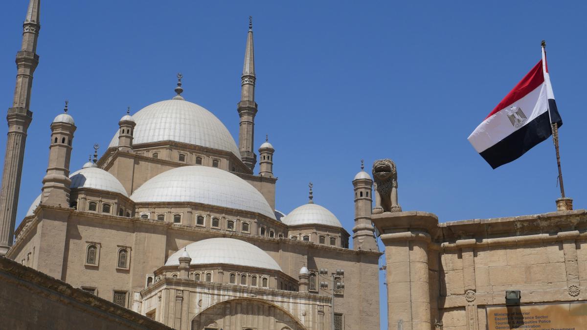 white concrete building under blue sky during daytime