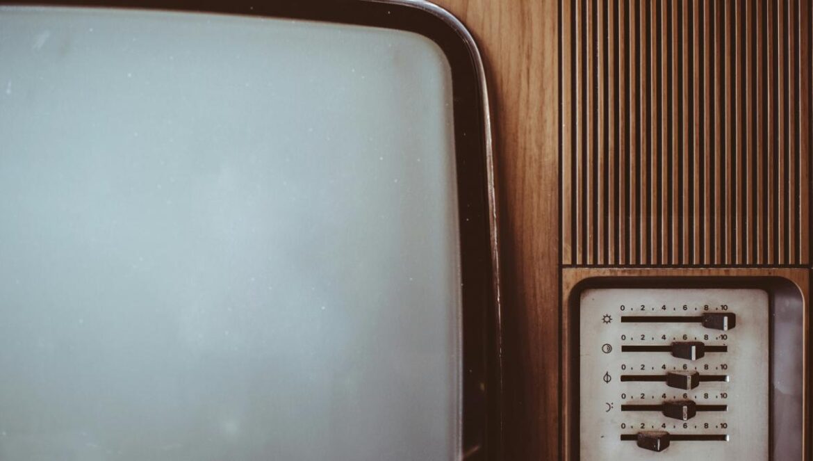 an old fashioned television set with a white screen