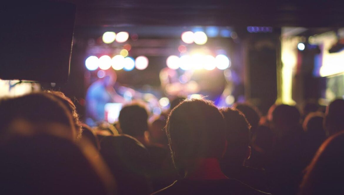 bokeh photography of man wearing shirt
