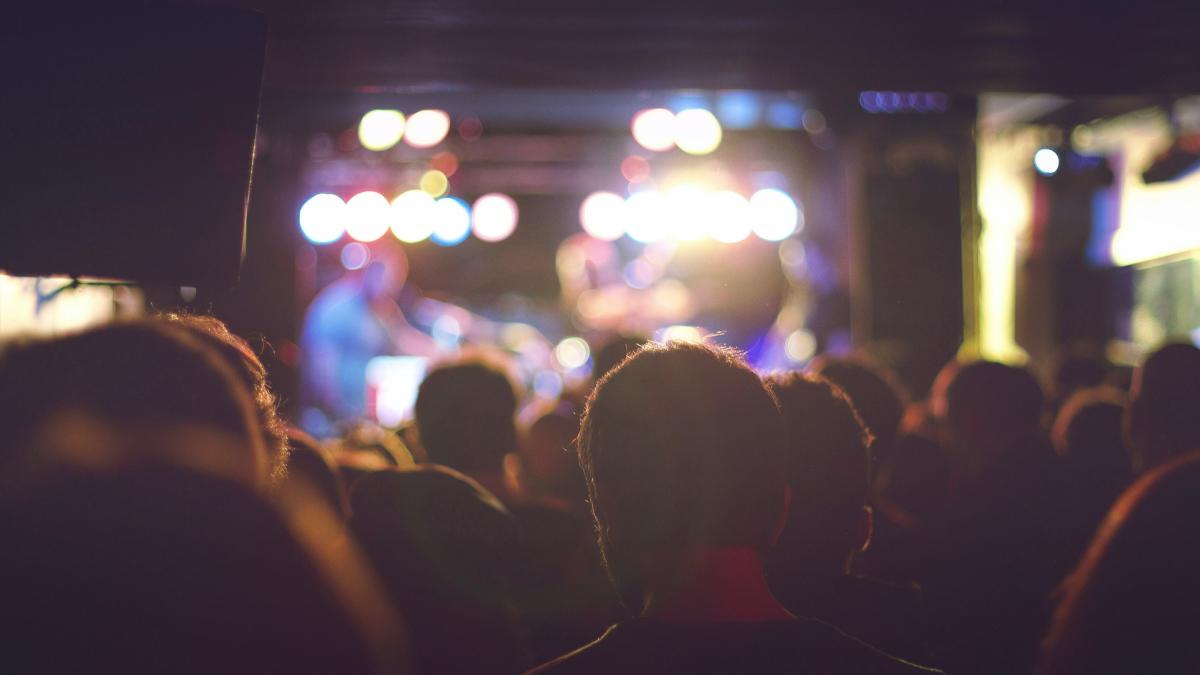 bokeh photography of man wearing shirt