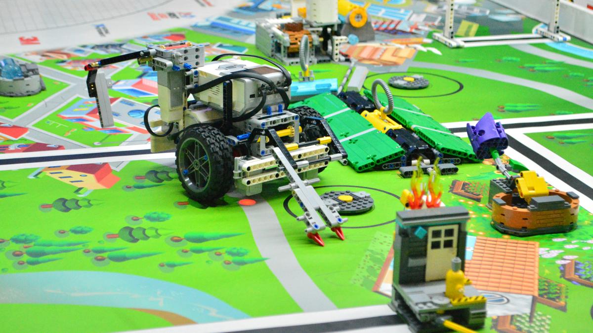 remote control toy car on green car track