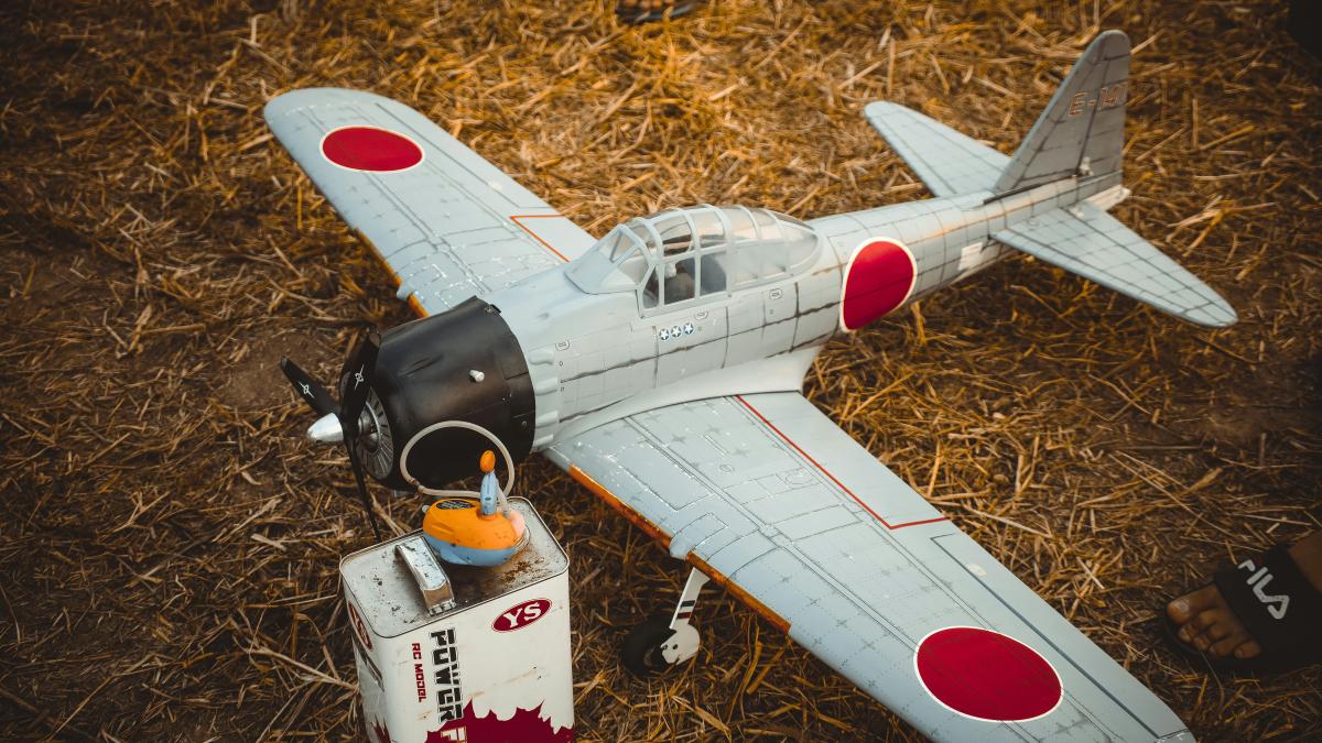white and red airplane miniature