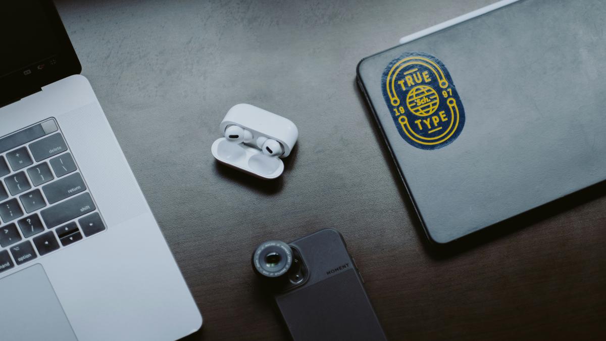 white apple earpods on gray iphone case