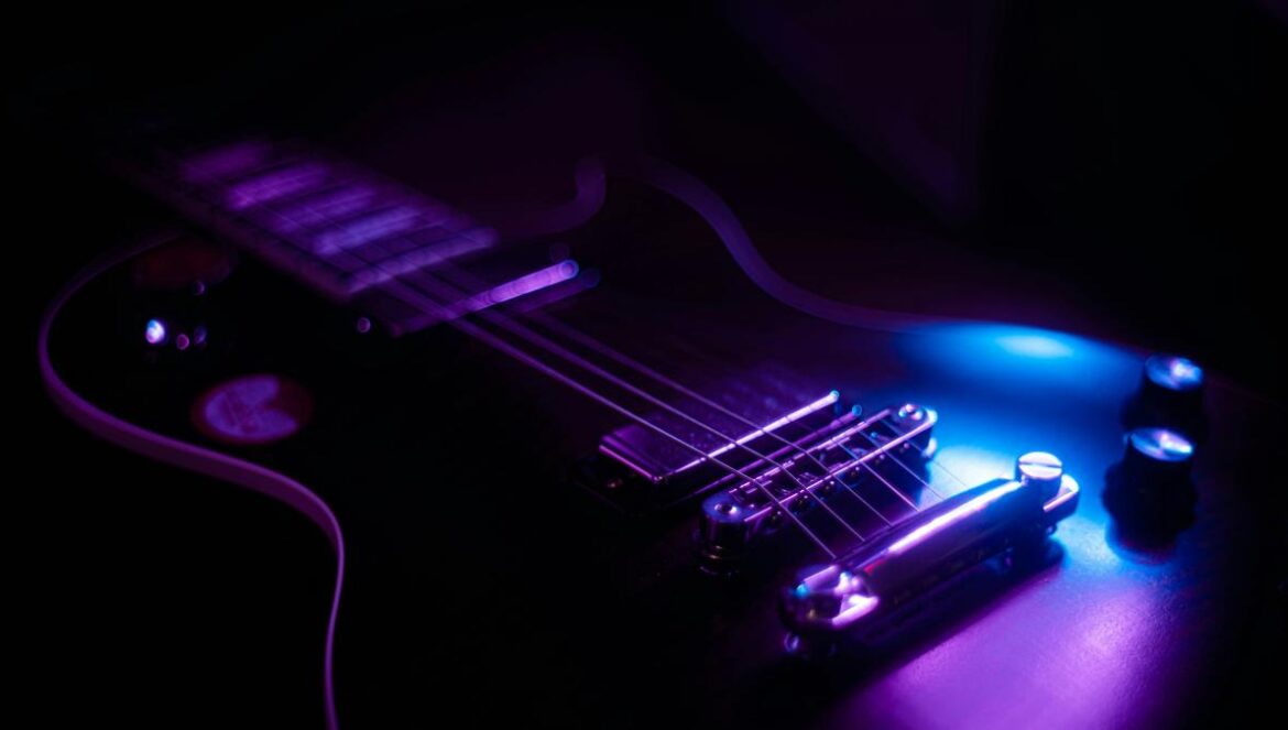 purple and black electric guitar