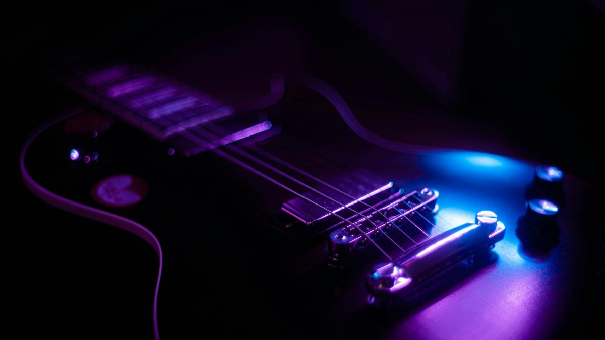 purple and black electric guitar