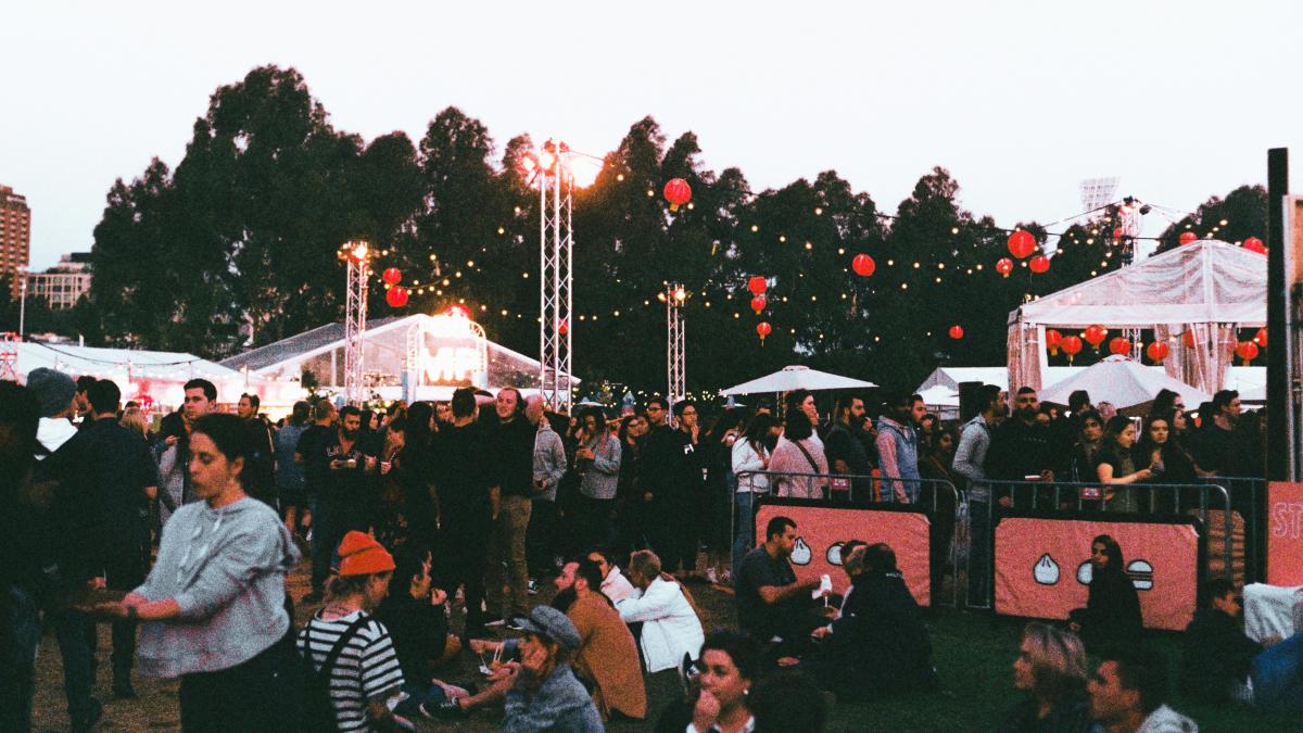 people sitting on green grass field during daytime