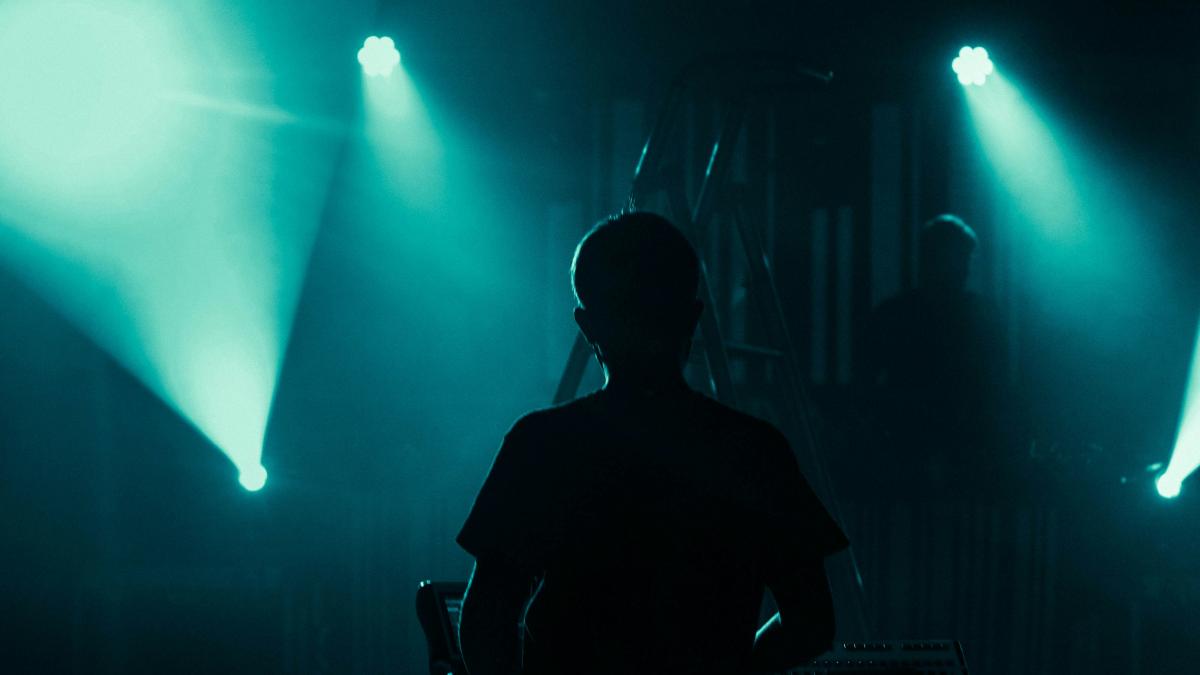 silhouette of man sitting on chair