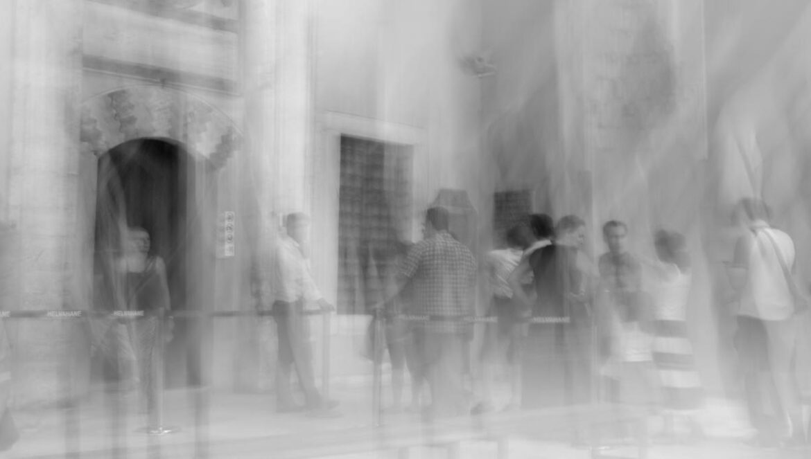 people walking on the street in grayscale photography