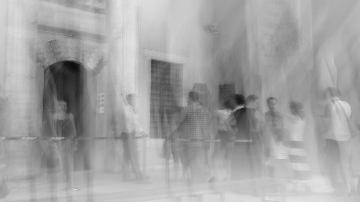 people walking on the street in grayscale photography