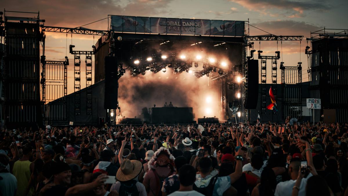 people watching concert during daytime